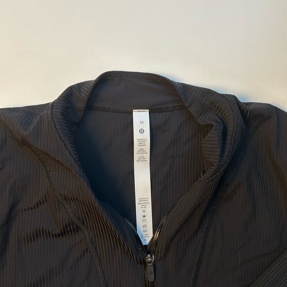 New with tags. Lululemon. Glass trim run 1/2 zip. Black. Size 10 - Picture 3 of 4